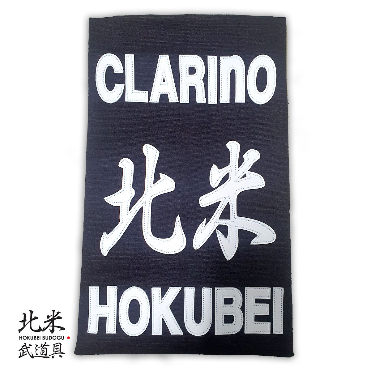 Clarino Kendo Zekken nafuda name tag made from synthetic leather with bold stitching, customizable with dojo and name.
